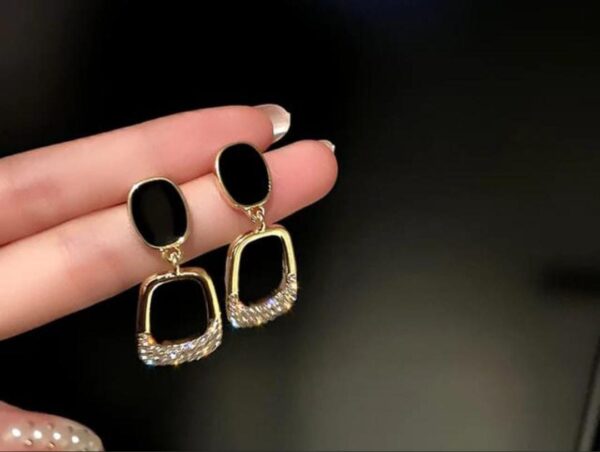 Black and golden long earrings