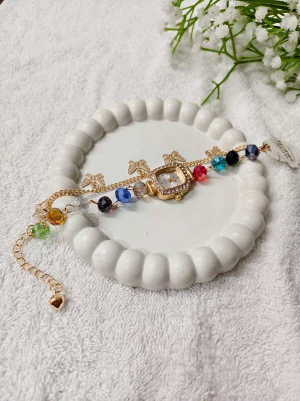 Watch with hanging charms